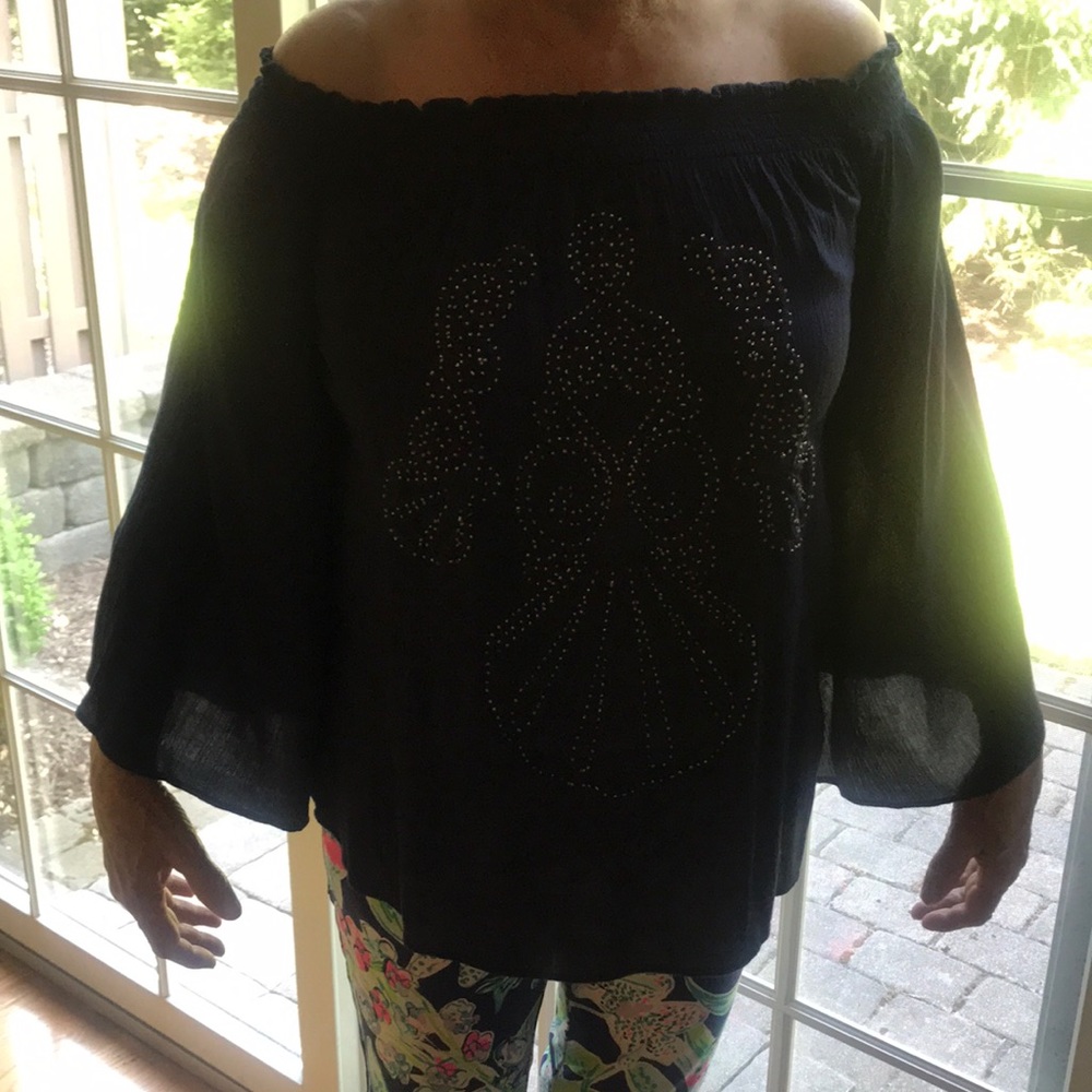 Navy off should top with gold beaded. Design in the front.